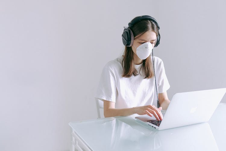 Woman In White Shirt Using Laptop Computer