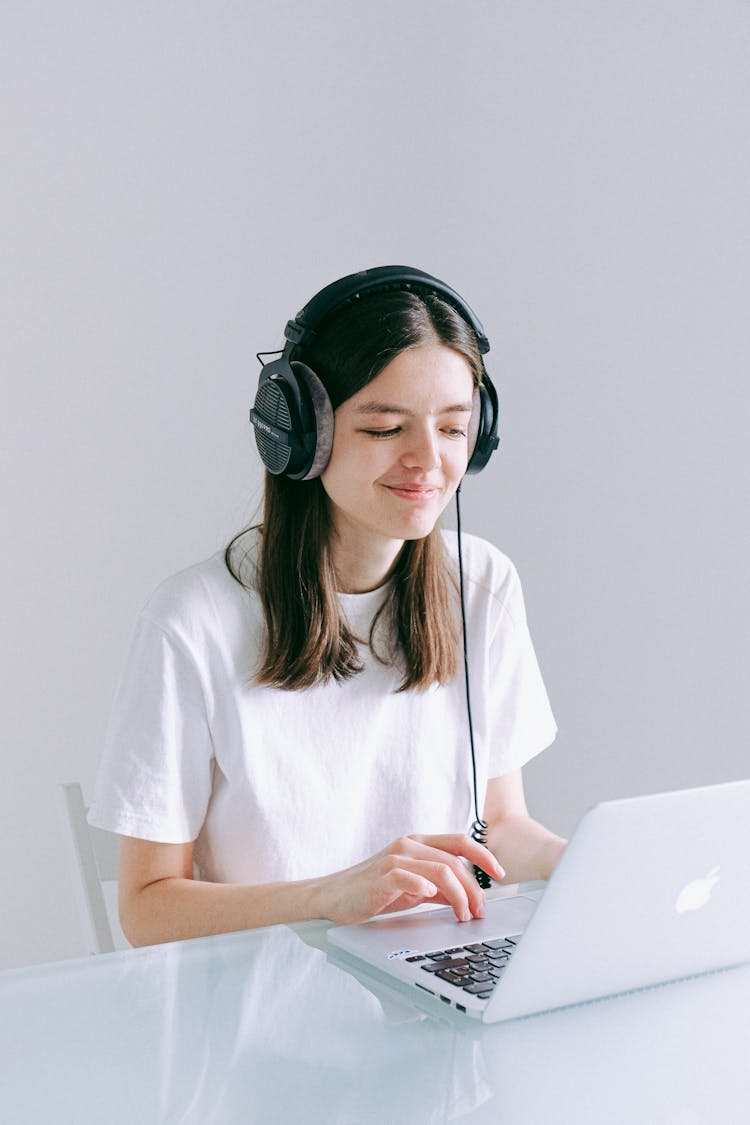 Woman In White Crew Neck T-shirt Using Laptop Computer