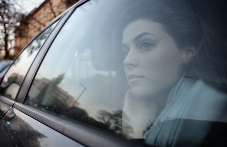 Woman Looking Out The Car Window