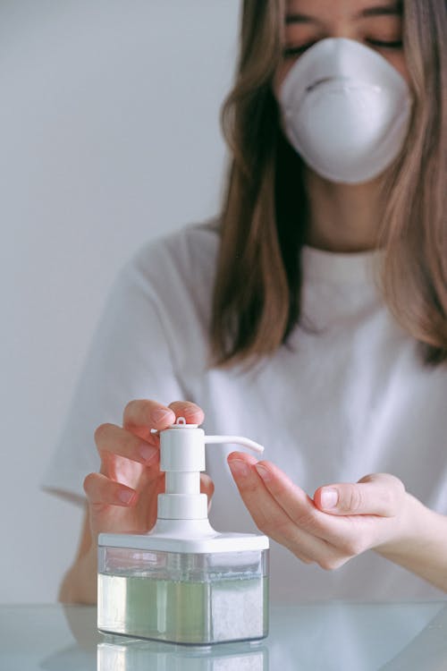 Woman Pumping Sanitizer