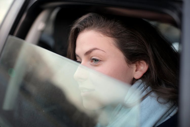 Woman Looking Out The Car Window