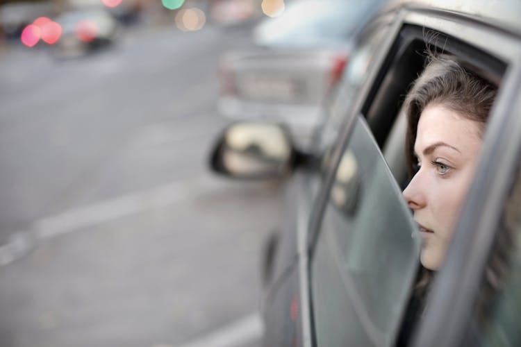 Woman Looking Out The Car Window