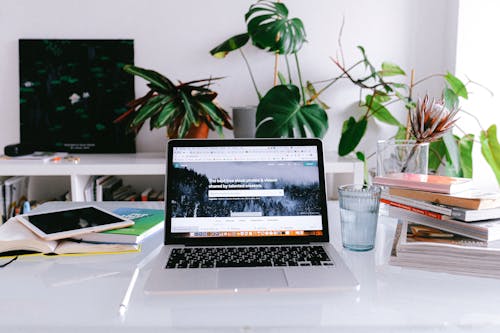 Macbook Pro On White Table