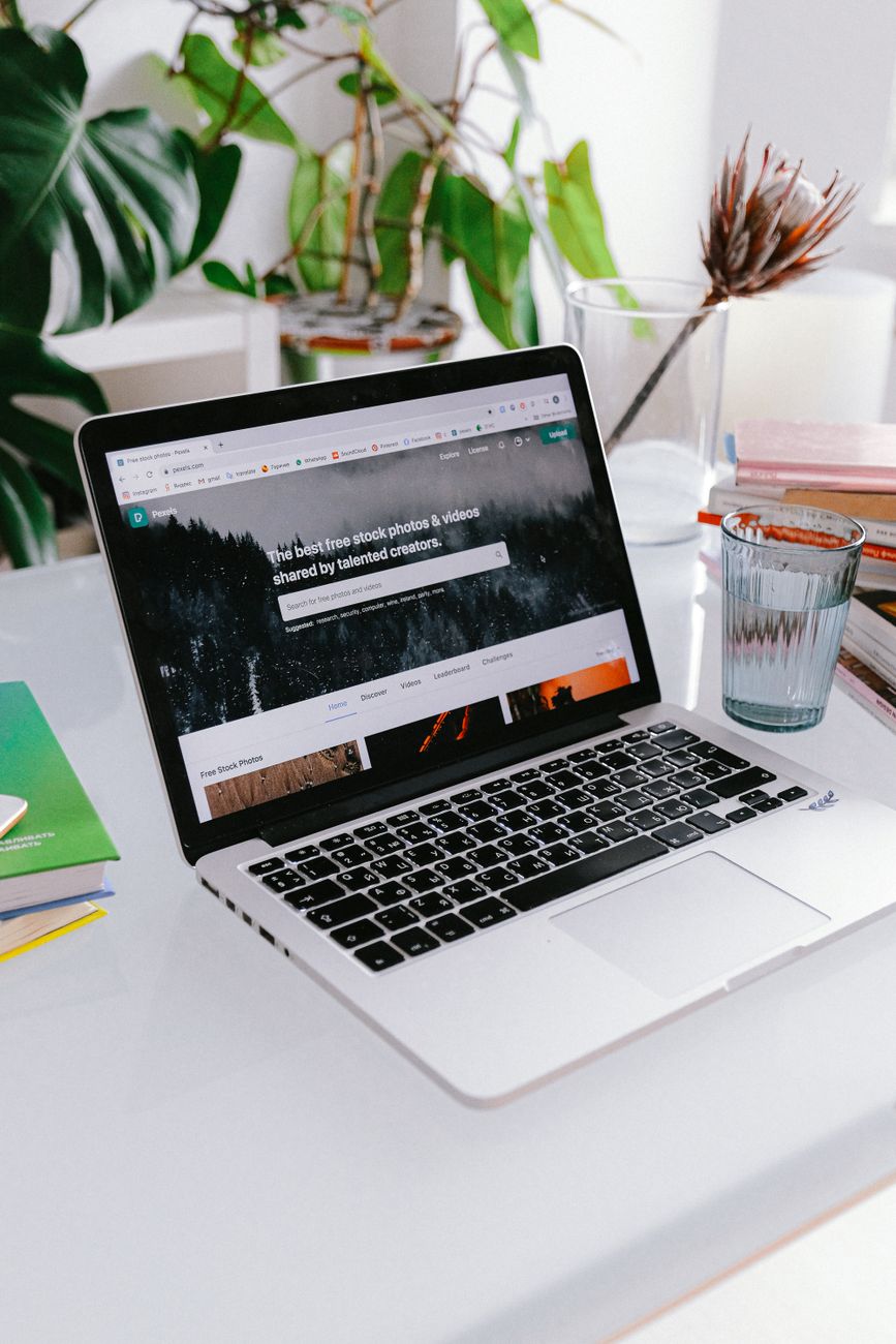 Macbook Pro On White Table · Free Stock Photo