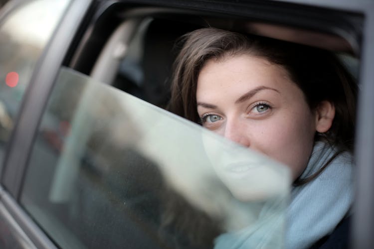 Woman Looking Out The Car Window