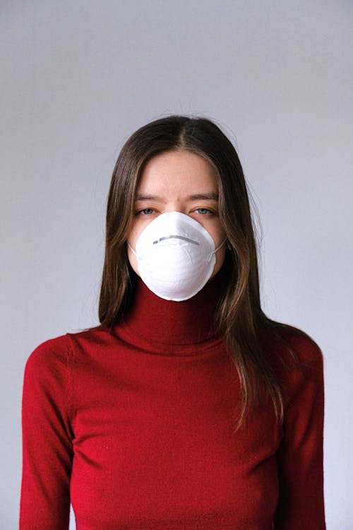 Woman in Red Turtleneck Wearing Face Mask