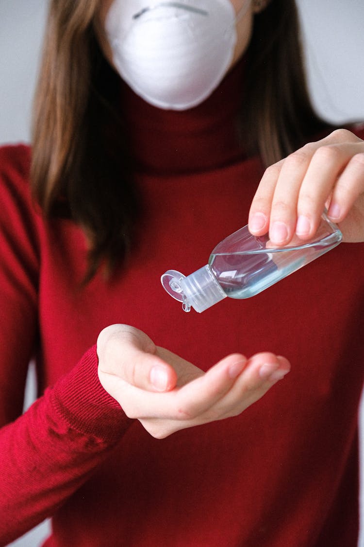 Woman Applying Hand Sanitizer