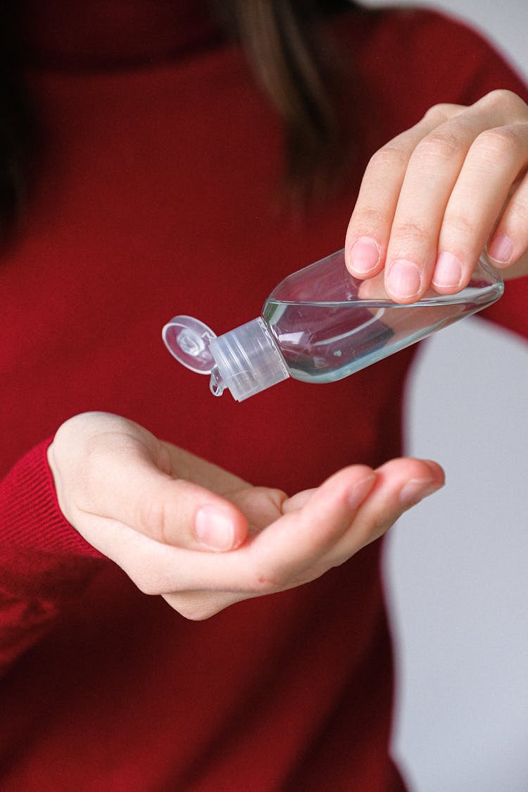 Woman Applying Hand Sanitizer