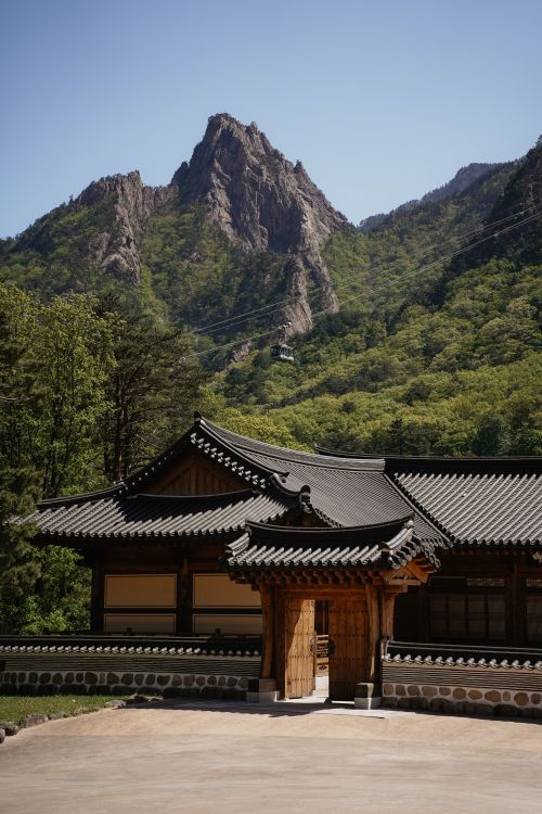 Free Beautiful view of traditional Korean architecture against Seoraksan mountains in Sokcho, South Korea. Stock Photo