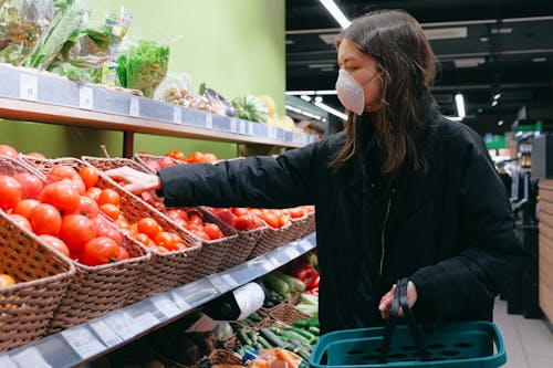 Free Woman in Face Mask Shopping in Supermarket Stock Photo
