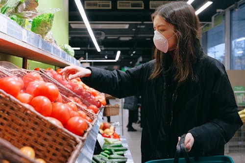Free Woman in Face Mask Shopping in Supermarket Stock Photo
