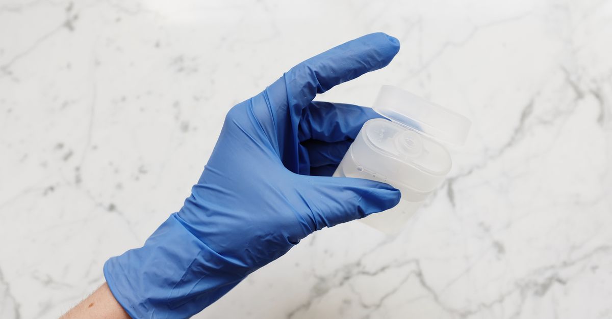 Person In Blue Gloves Holding Clear Plastic Container Free Stock Photo person-in-blue-gloves-holding-clear-plastic-container-free-stock-photo