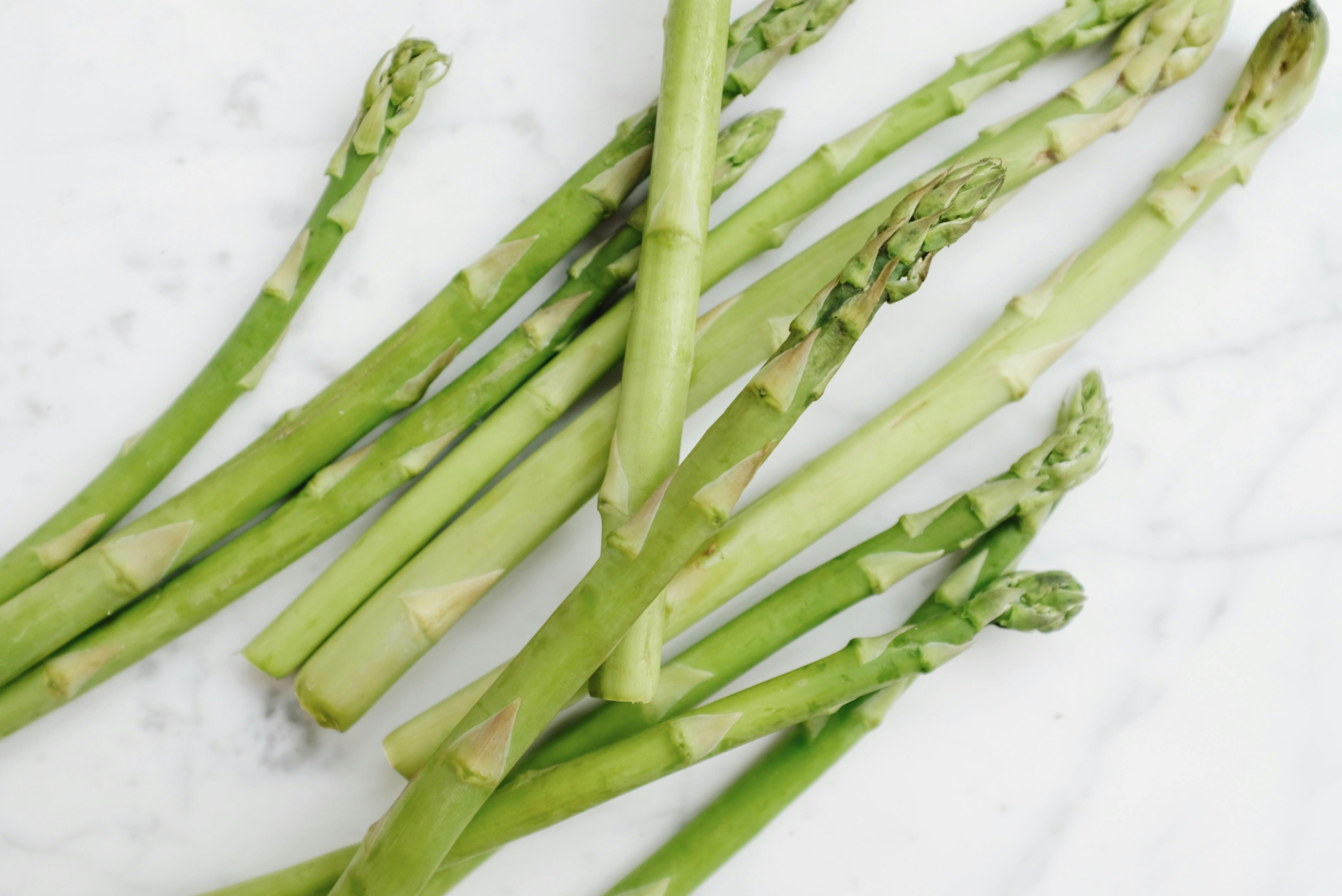 Green Asparagus on White Surface · Free Stock Photo