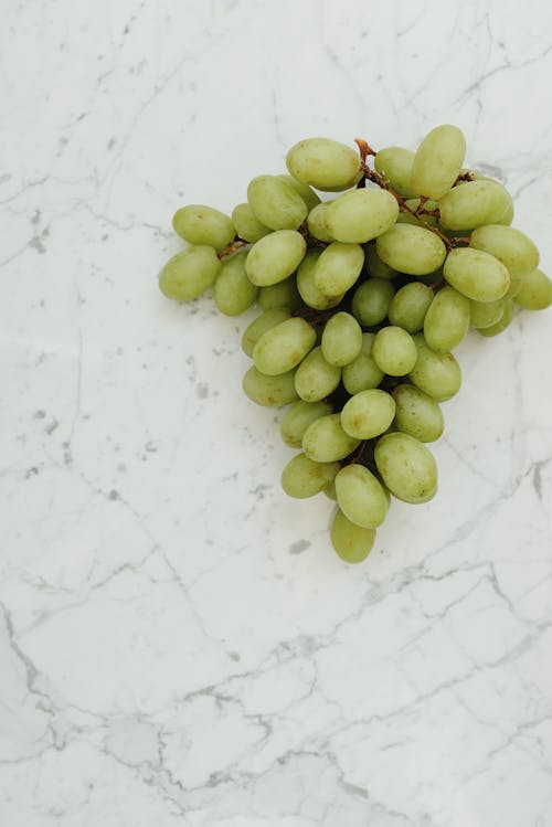 Green Grapes on White Surface