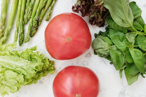 Free Red Tomatoes Beside Green Vegetables Stock Photo