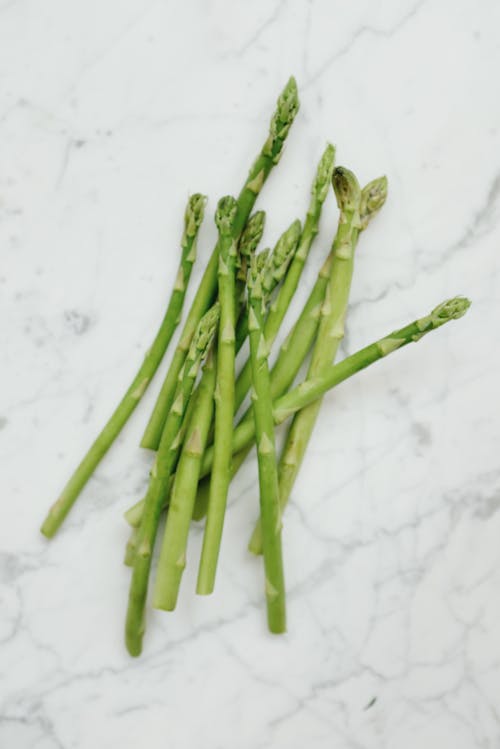 Green Asparagus on White Table