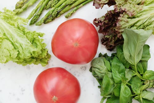 Red Tomato Beside Green Vegetable