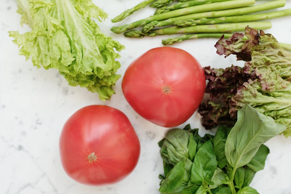 Free Red Tomatoes Beside Green Vegetables Stock Photo