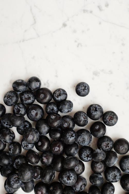 Close up of Blueberries on White Surface 