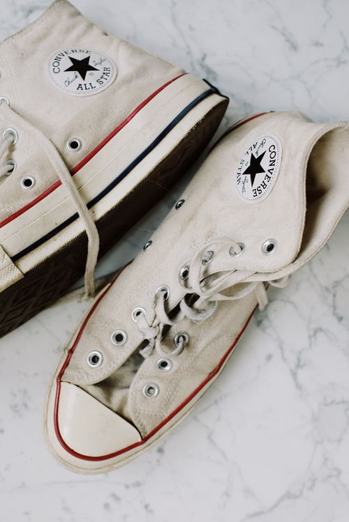 Free Vintage Converse All Star sneakers showcased on a marble background. Stock Photo