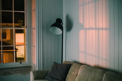 Black Floor Lamp Beside Gray Couch