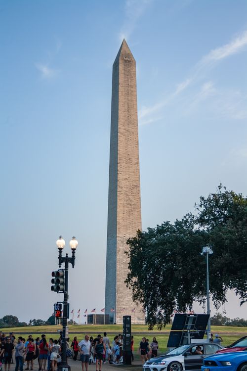 Free View of the Washington Monument in Washington D.C. with clear skies and people nearby. Stock Photo
