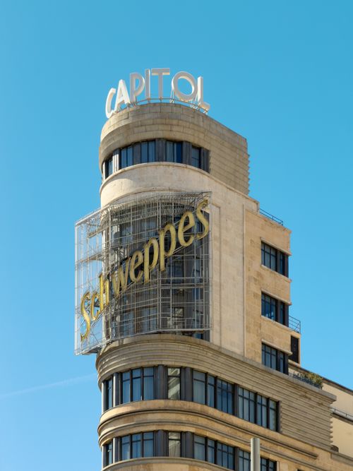 Free Iconic Edificio Capitol in Madrid with famous Schweppes signage. Stock Photo