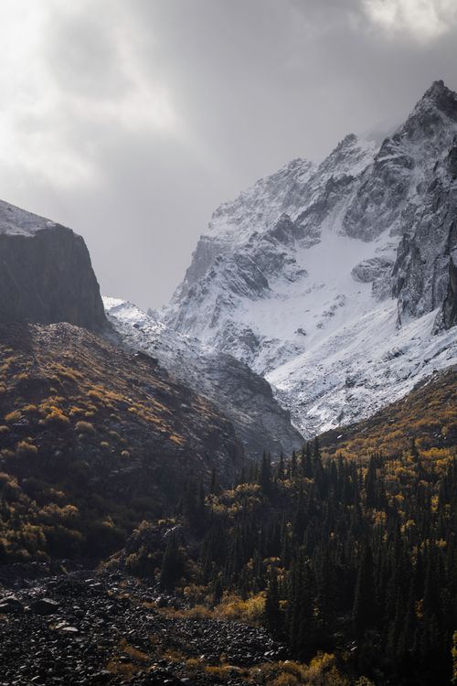 Free Stunning view of snow-covered mountains and autumn foliage in Kyrgyzstan. Stock Photo