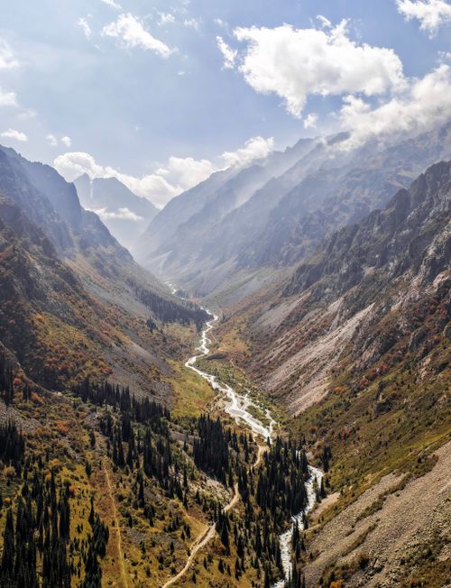Free Stunning aerial image of a mountain valley in Kyrgyzstan showcasing natural beauty and dramatic landscapes. Stock Photo