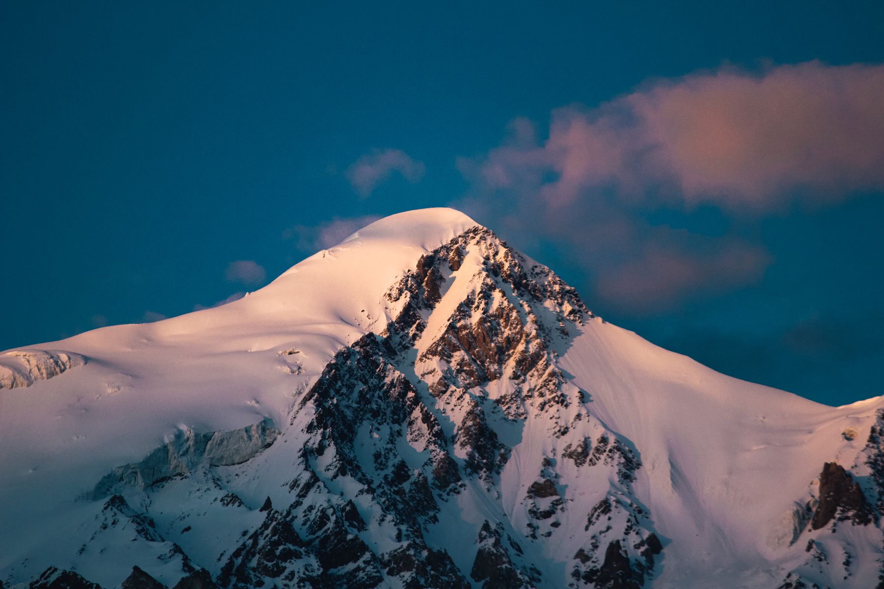 A breathtaking view of a snow-covered mountain peak at sunrise in Shigar.