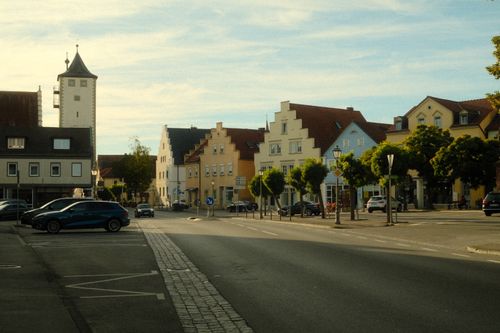 Free A picturesque view of a quaint German town featuring traditional architecture and clear blue skies. Stock Photo