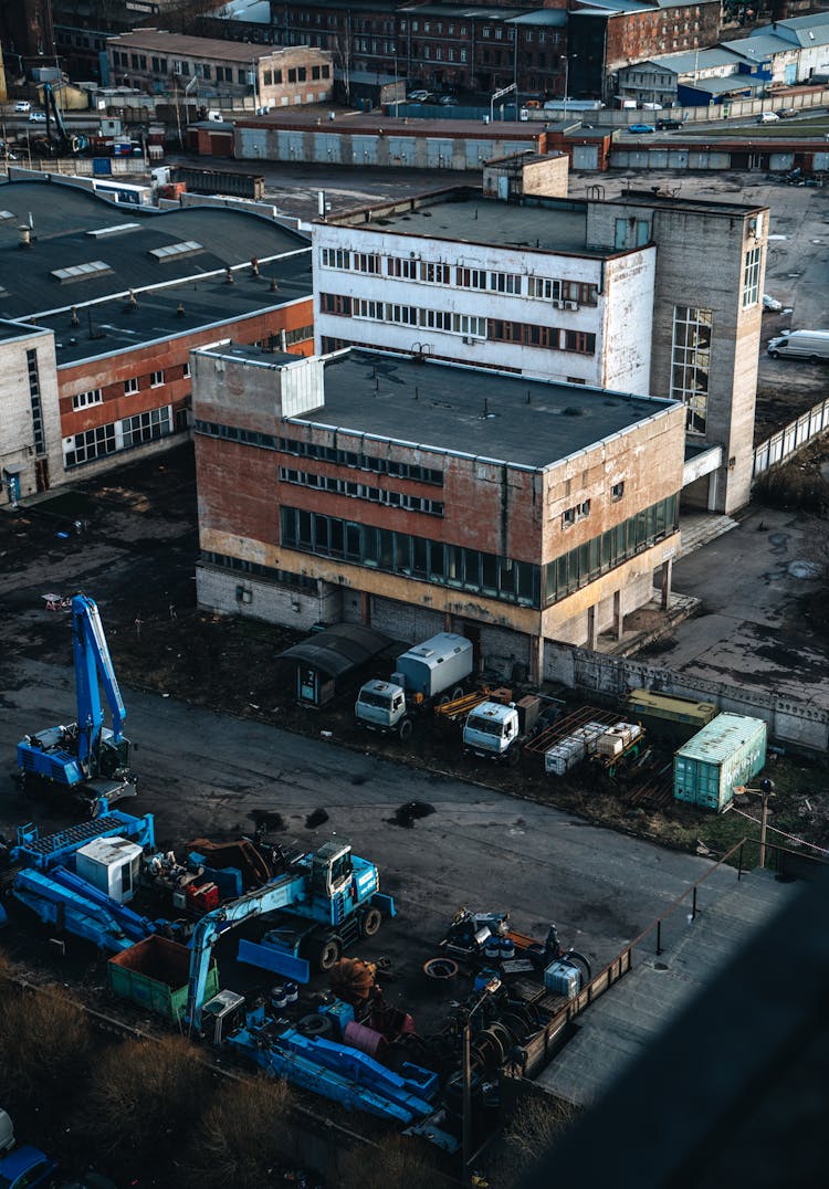 Aerial Shot Of Trucks Parked Near A Building