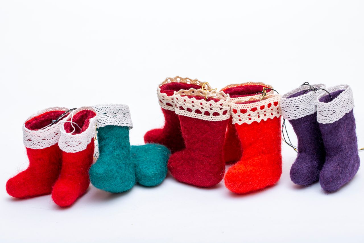 Small felt Christmas stockings in red, teal and purple with lace trim