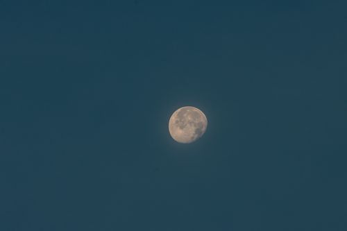 Free A serene view of the full moon against a deep, clear night sky above Jönköping, Sweden. Stock Photo