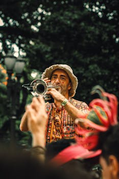A lively street musician performs with a trumpet at a vibrant outdoor festival, captivating the audience.