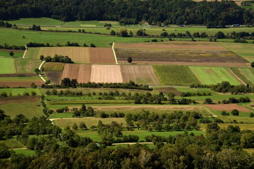 Free Aerial view of picturesque agricultural fields in Kirchehrenbach, Bavaria. Stock Photo
