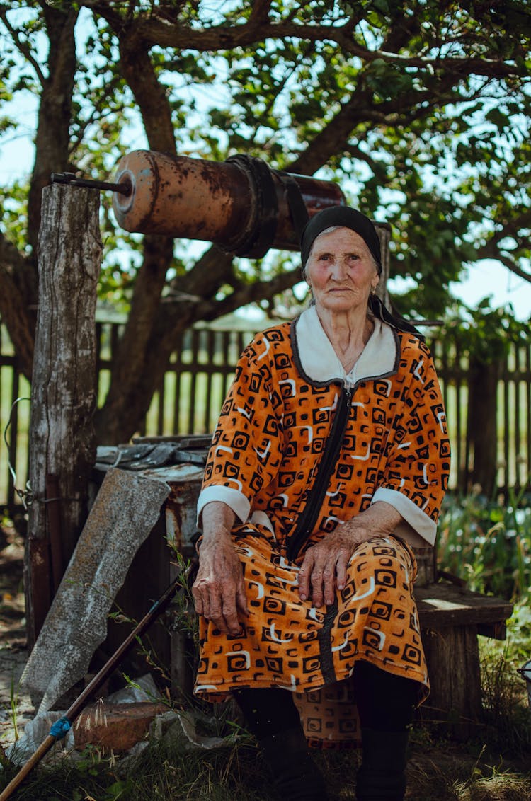 Woman Sitting By The Well