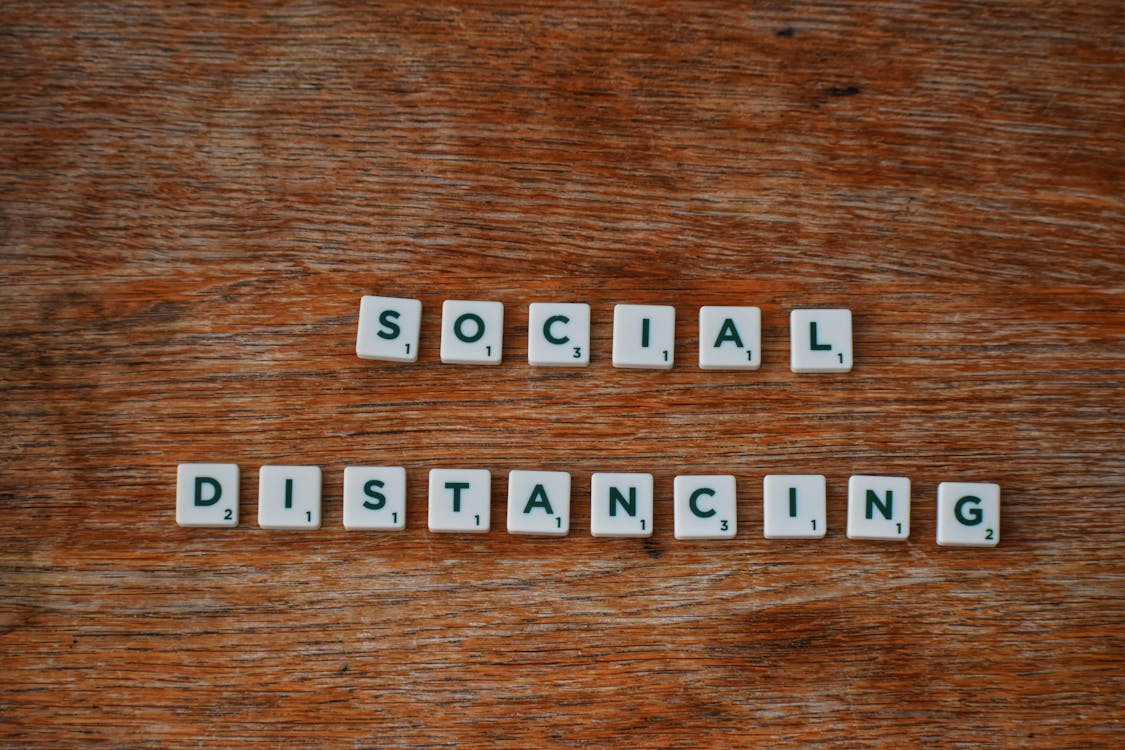 Social Distancing on Wooden Table