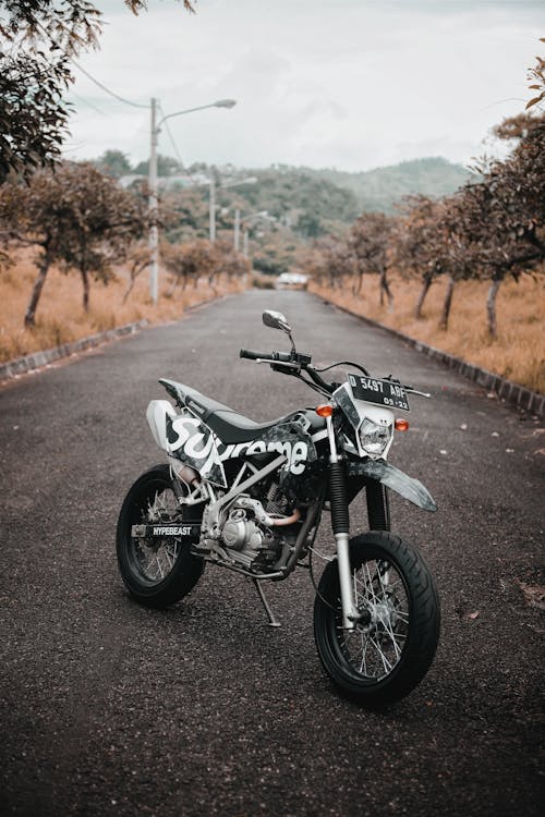 Free Black and Silver Sports Bike Parked on the Road Stock Photo
