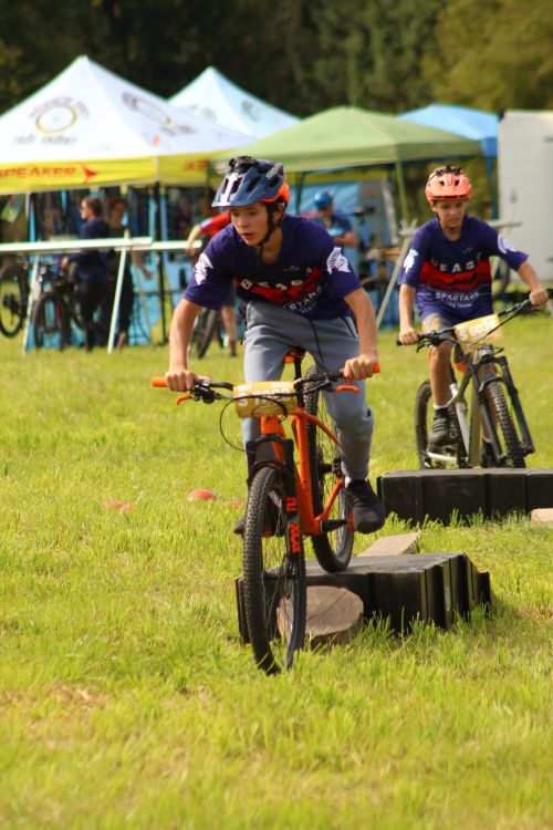 Free Young riders competing in a mountain biking race outdoors. Fun and sporty adventure. Stock Photo