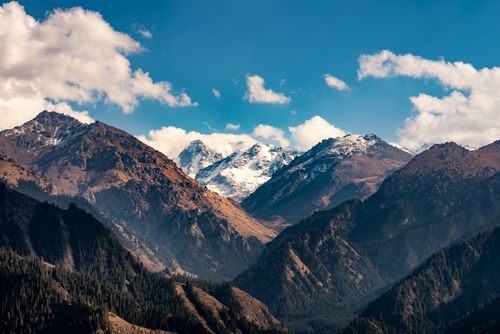 Free Beautiful view of the Tian Shan mountains in Xinjiang, China, under a bright blue sky. Stock Photo