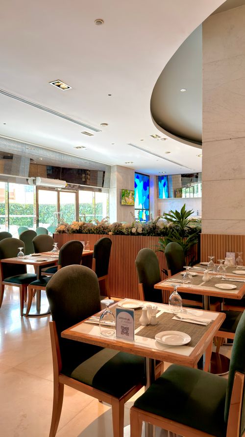 Free Bright and elegant restaurant interior featuring stylish seating and vibrant decor. Stock Photo
