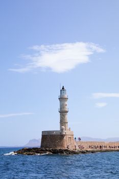 Chania Lighthouse in Crete, Greece, under a clear blue sky. Perfect maritime and architectural view.