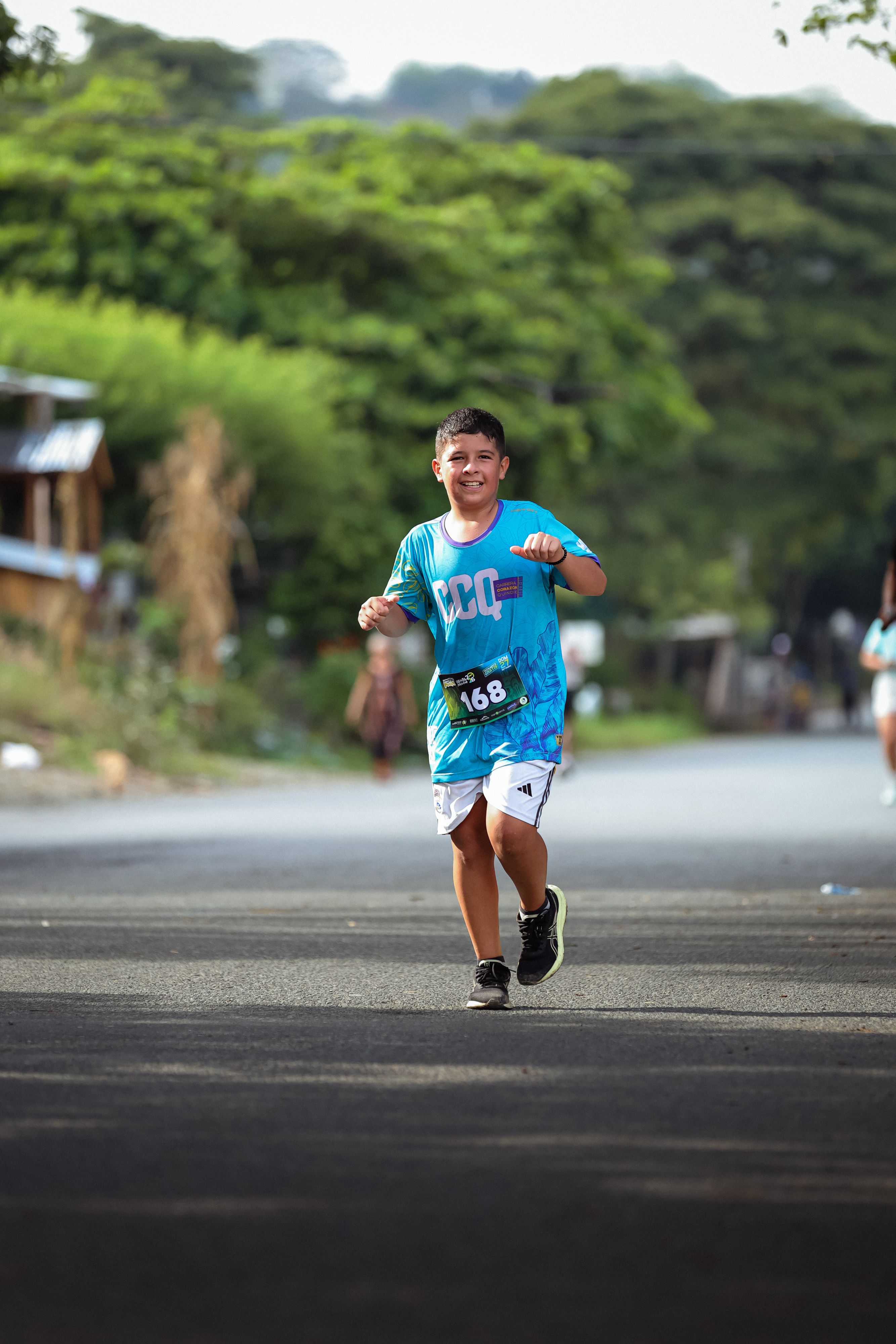 Energetic boy participating in a local marathon, showcasing joy and determination.