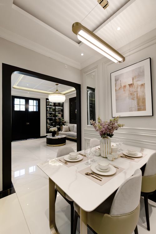 Free Stylish and modern dining room interior with elegant decor and chic lighting. Stock Photo