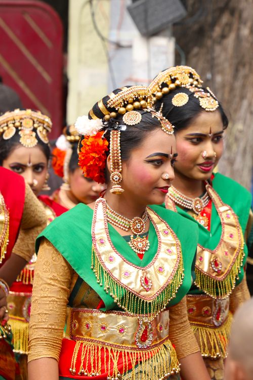 Free Group of Indian women in traditional dance costumes with jewelry and makeup outdoors. Stock Photo