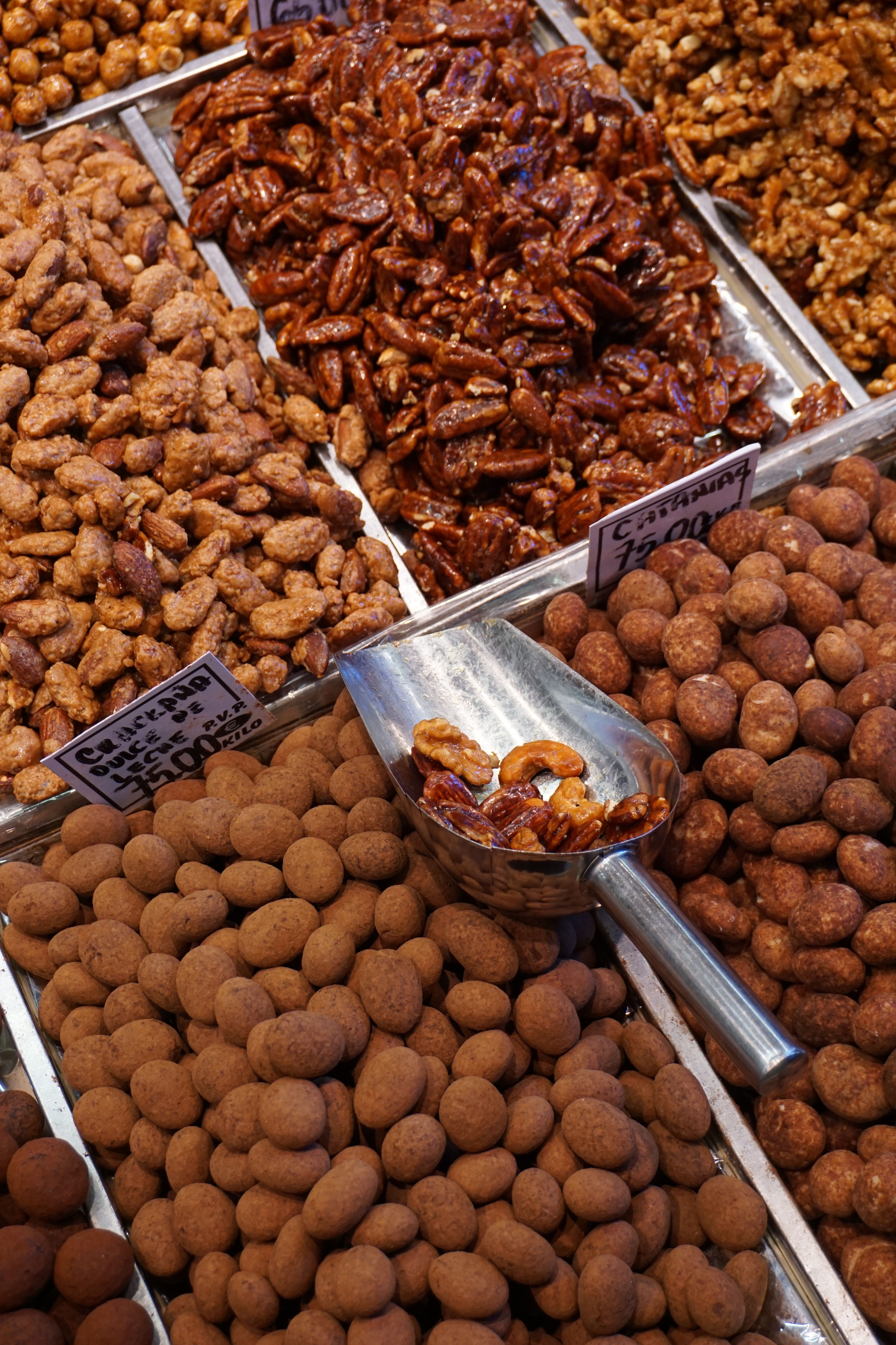 Diverse selection of nuts at a market in Barcelona. Perfect for food-related content.