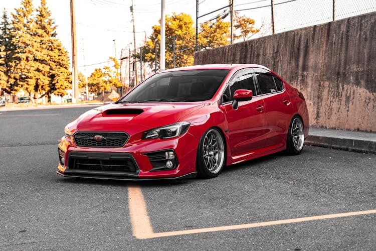 Red Subaru Sedan On Road