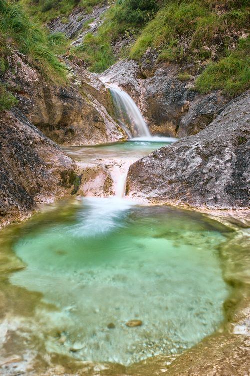 Free Beautiful cascading waterfall in Schneizlreuth, Bavaria surrounded by rocky terrain. Stock Photo