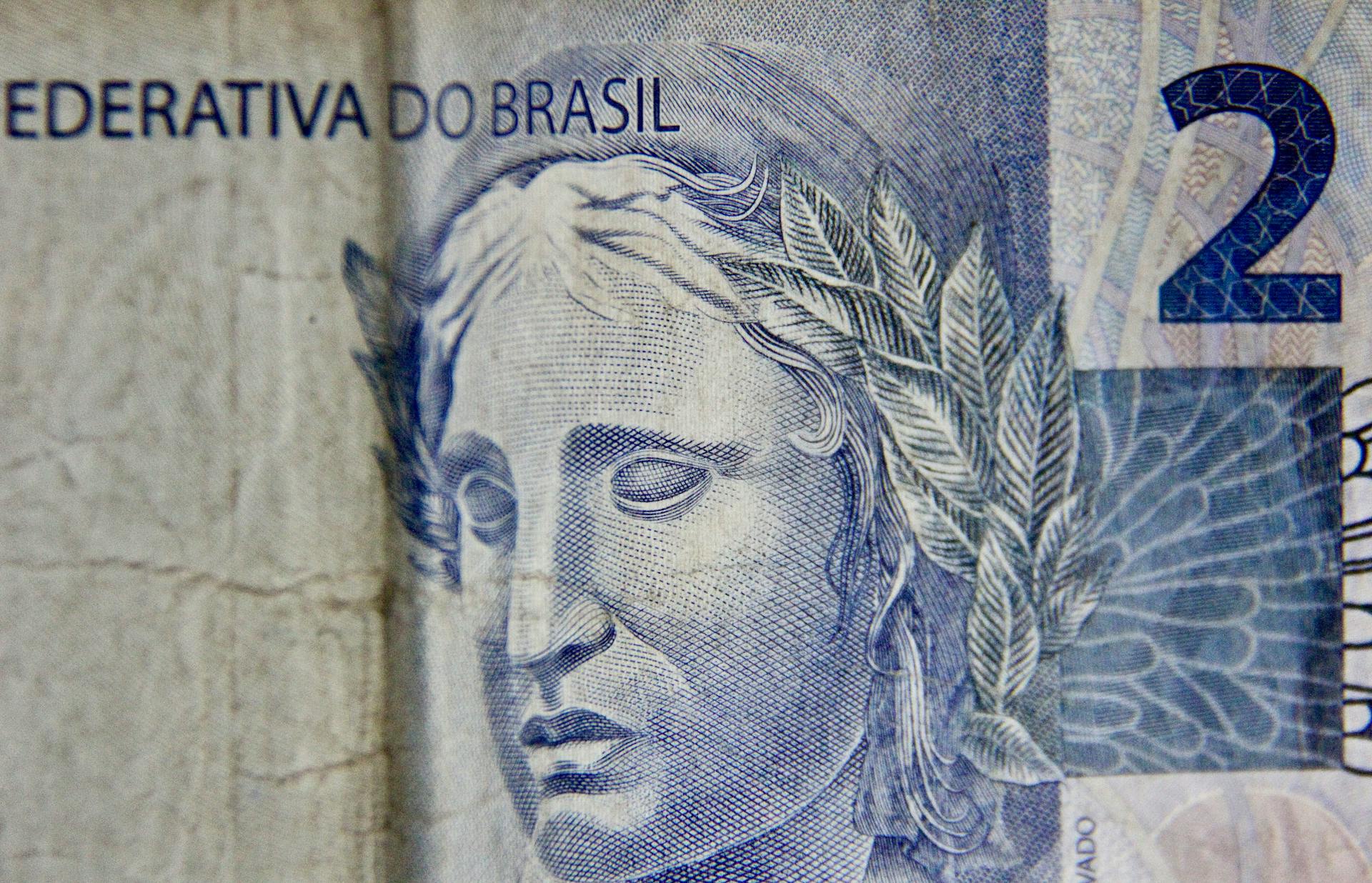 Detailed close-up of a Brazilian two real banknote emphasizing its artistic design.